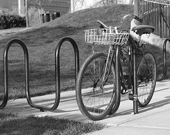 A bike locked to a bike rack