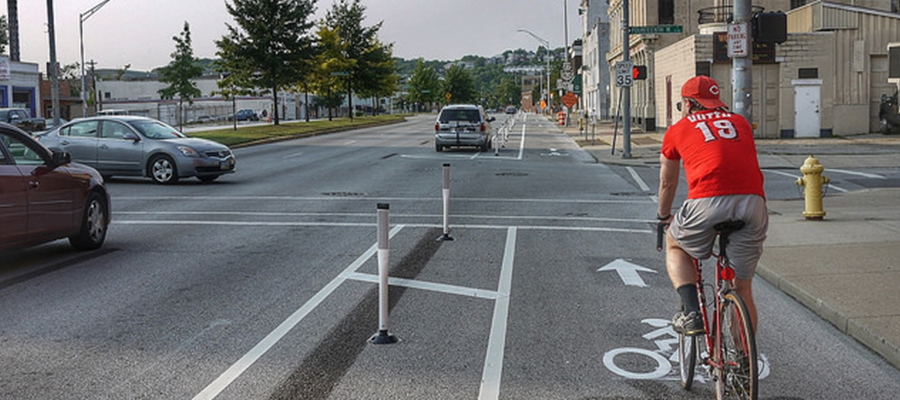 Cyclist using bike lane at an intersection