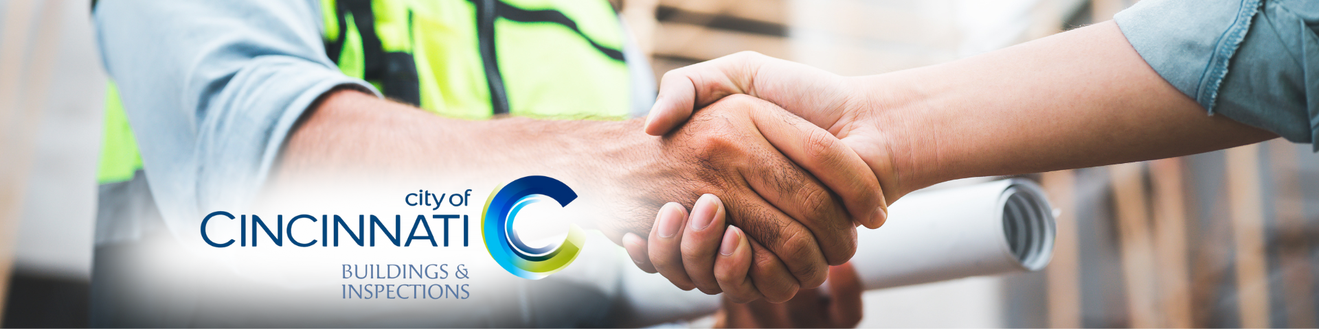 City of Cincinnati Logo, photo is of two hands clasped into a handshake