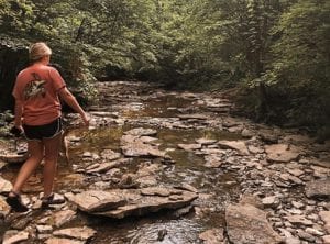 Woman walking in French Park Creek