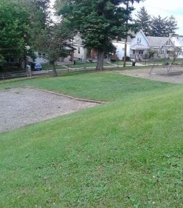 green lawn with playground