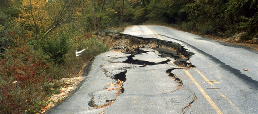 A street starts to slip down a hillside