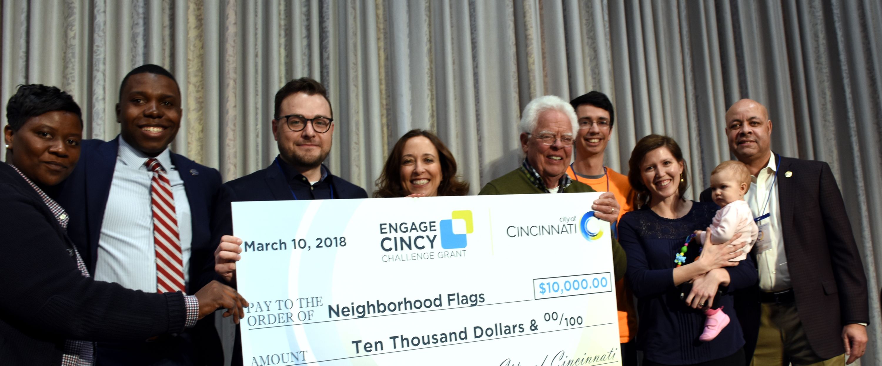 Neighborhood Flags Accepts Check at Neighborhood Summit