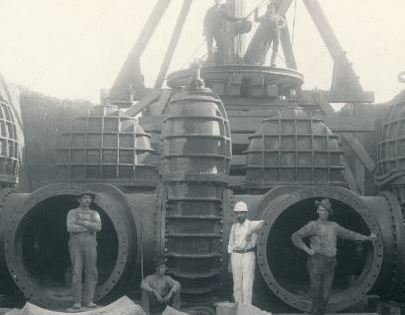 Workers at New Water Works Treatment Plant in front of large water main